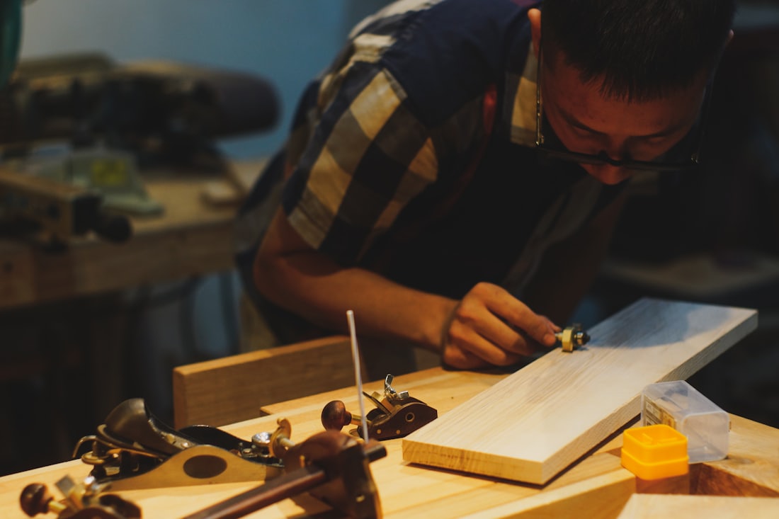 The studio — a working bench with drawings and tools